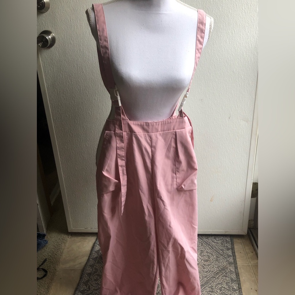 Pink jumper with Buckle straps